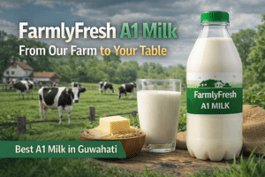 FarmlyFresh A1 Milk bottle, glass of milk, butter, and cows in the background with text overlay "FarmlyFresh A1 Milk From Our Farm to Your Table" and "Best A1 Milk in Guwahati"